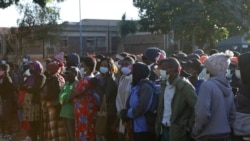 People wait in a queue to be vaccinated at a government hospital in Harare, Zimbabwe on Friday, Sept, 17, 2021. (AP Photo/Tsvangirayi Mukwazhi)