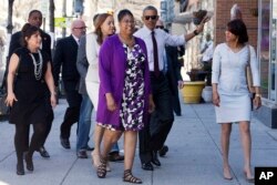 FILE - After commuting the sentences of 61 drug offenders, President Barack Obama meets with several formerly incarcerated people to learn about re-entry challenges, over lunch in Washington, D.C., March 30, 2016.