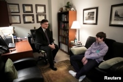 Dr. Chris Tuell, Clinical Director of Addiction Services, poses with Danny Reagan, a former residential patient of the Lindner Center of Hope, in Mason, Ohio, Jan. 23, 2019.