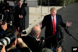 President Donald Trump speaks to reporters on the South Lawn before leaving the White House in Washington, Nov. 29, 2018 to attend the G20 Summit in Buenos Aires, Argentina.