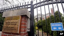 A metal fence surrounds the residence of Russia's consul general Monday, March 26, 2018, in Seattle.