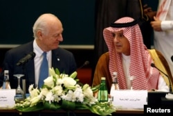 Saudi Foreign Minister Adel al-Jubeir, right, speaks with U.N. Special Envoy for Syria Staffan de Mistura during a Syrian opposition meeting in Riyadh, Saudi Arabia, Nov. 22, 2017.
