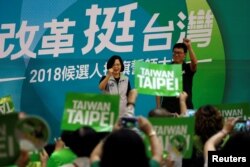 Taiwanese President Tsai Ing-wen and Democratic Progressive Party (DPP) Taipei mayoral candidate Pasuya Yao, attend a mayoral and magisterial election campaign rally in Taipei, Taiwan, Aug. 3, 2018.