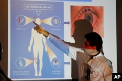 Colombia's Health Minister Alejandro Gaviria explains the symptoms of Zika during an event to launch a nationwide prevention campaign against the virus in Ibague, Colombia, Jan. 26, 2016.
