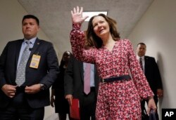Gina Haspel, President Donald Trump's nominee to become CIA director, waves as she arrives for her meeting with Sen. Joe Manchin, D-W.Va., on Capitol Hill in Washington, May 7, 2018.