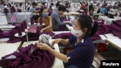 Labourers work at a garment factory in Bac Giang province, near Hanoi