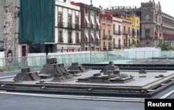 A model of the major structures of the ceremonial precinct of the Aztec capital of Tenochtitlan, including the temple to the wind god and ball court, as seen outside the ruins of the Templo Mayor in downtown Mexico City, Mexico, June 7, 2017.