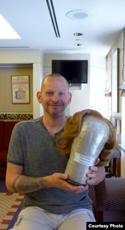 It took Jason P. Hayes almost a week to weave thousands of strands of human hair into just this one wig for the character of Charlotte in Casa Valentina. (J. Lunden/VOA)