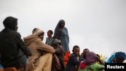 FILE - Ethiopian asylum seekers gather at the Somare refugee camp on the Ethiopian-Kenyan border near the town of Moyale, Kenya, March 27, 2018.