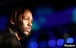 FILE - Musician Kendrick Lamar arrives at the 2017 MTV Video Music Awards in Inglewood, California, Aug. 27, 2017.