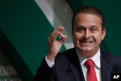 In this Aug. 6, 2014 photo, Brazilian Socialist Party (PSB) presidential candidate Eduardo Campos campaigns in Brasilia, Brazil.