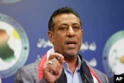Iraqi lawmaker, Hakim al-Zamili, speaks to the media during press conference, in Baghdad, April 18, 2016.