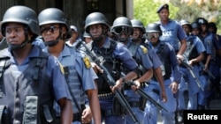 Riot police officers patrol the campus ahead of student protests demanding free education at Johannesburg's University of the Witwatersrand, South Africa, October 11,2016.
