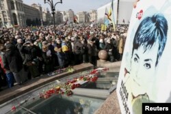 People take part in a rally in central Kyiv, Ukraine, demanding liberation of Ukrainian army pilot Nadezhda Savchenko by Russia, March 6, 2016.