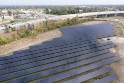 An aerial view shows solar panels made by First Solar, during a tour of the Overland Park Solar Array in Toledo, Ohio, Oct. 5, 2021.