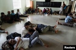 Pakistan refugees rest inside a mosque in Negombo, Sri Lanka, April 25, 2019.