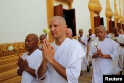 Turkish-German patient Cengiz, centern attends his ordination ceremony at Wat Thamkrabok monastery in Saraburi province, Thailand, March 30, 2017.