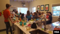 Staff members at Dr. Yum Pediatrics help out during the cooking classes.