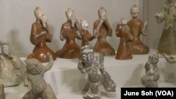 Ceramic figurines of musicians and dancers illustrate the joyful mixing of cultures during the time of the legendary Silk Road, approximately 1,990 - 2,220 years ago.