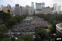 FILE - This general view shows thousands of protesters gathered ahead of the start of a rally against a controversial extradition law proposal in Hong Kong, June 16, 2019.