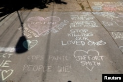 Memorials in the alleyway for Justine Damond, who was shot by a Minneapolis police officer in Minneapolis, Minnesota, July 17, 2017.