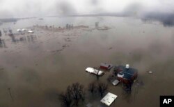 An aerial photo shows flooding along the Missouri River in Pacific Junction, Iowa, March 19, 2019.