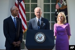 FILE - Vice President Joe Biden, accompanied by his wife Jill and President Barack Obama, announces that he will not run for the presidential nomination, Oct. 21, 2015, in the Rose Garden of the White House in Washington.