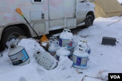 Many tent and yurt-owners on the campsite have been using propane to heat their winter shelters (Photo: E. Sarai/VOA)