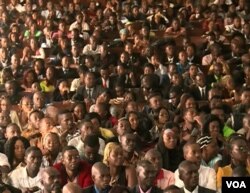 Students sit, waiting for their laptops at the University of Yaounde II, in Soa, near Yaounde, Cameroon, Dec. 27, 2017. (M. Kindzeka/VOA)
