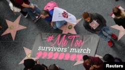 Women take part in a #MeToo protest march for survivors of sexual assault and their supporters in Hollywood, Los Angeles, California U.S. November 12, 2017.