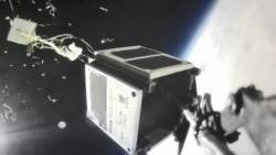 WISA Woodsat’s "selfie stick" camera captured this picture just as the satellite's carrier balloon exploded, as planned, at the altitude of 31.2 kilometers. In addition to the balloon fragments, the image shows parts of the flight train and the space view