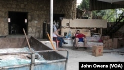 With work conditions tough due to the sweltering heat of the furnace, those working take regular breaks.