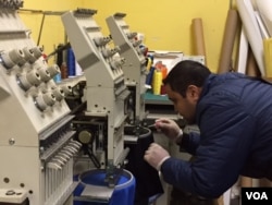 Printer Luis Bustos came to the U.S. to start his own business, something he said was not easy in Mexico. (C. Presutti/VOA)