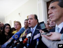 FILE - Julio Borges, center, President of Venezuela's National Assembly, speaks during a news conference prior the start of a session of Congress in Caracas, Venezuela, Aug. 2, 2017.