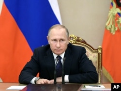 FILE - Russian President Vladimir Putin heads a meeting on the budget in Moscow's Kremlin, Russia, Sept. 26, 2016.