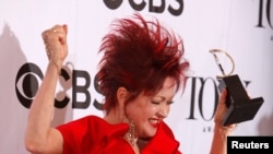 Cyndi Lauper celebrates with her award for Best Original Score at the 67th Annual Tony Awards. REUTERS/Carlo Allegri