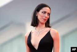 FILE - Actress Rebecca Hall poses for photographers at the Venice Film Festival in Venice, Italy, Sept. 5, 2017.