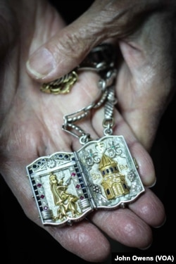 Master jeweler Hrayr Dserounian shows one of the recent pieces he has crafted, in Beirut, Lebanon, April 1, 2016. The iconography reflects Armenian history.