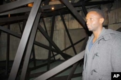 The artist says the wooden beams he’s used could represent the many “harsh” challenges that asylum seekers and refugees have to face