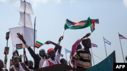 Dancers put on a short theatrical performance promoting unity in South Sudan and hope for a peaceful future in the war torn nation during celebrations marking three years of Independence in Juba, July 9, 2014.