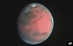 Barcha sayyoralardan insoniyatni aynan Mars qiziqtirib keladi. Xabble teleskopi yordamida olingan surat.