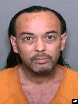 This booking video image released by the Orange County Sheriff's Department shows 51-year-old Forrest Gordon Clark, who was booked into Orange County jail in Santa Ana, Calif., Aug. 8, 2018, on suspicion of two counts of felony arson, and one count each of felony threat to terrorize and misdemeanor resisting arrest.