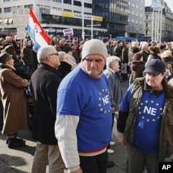 Croatian anti-EU protesters rally in the central square of Zagreb Saturday, January 21, 2012.