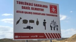 Mina təhlükəsi ilə bağlı reklam lövhəsi