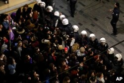 Turkish police block protesters wanting to hold a march for the International Women's Day, in Istanbul, March 8, 2019.
