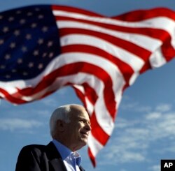 FILE - Republican presidential candidate Sen. John McCain, R-Ariz. speaks at a rally outside Raymond James Stadium in Tampa, Florida, Nov. 3, 2008.