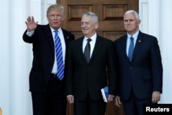 U.S. President-elect Donald Trump and Vice President-elect Mike Pence greet retired Marine General James Mattis for a meeting at the main clubhouse at Trump National Golf Club in Bedminster, New Jersey, Nov. 19, 2016.