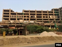 Many building projects are stalled due to a slowdown in demand. (A. Pasricha/VOA)