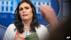 White House press secretary Sarah Huckabee Sanders talks to reporters during a press briefing in the Brady Press Briefing Room at the White House, in Washington, Nov. 27, 2017.