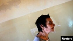 FILE - A patient is seen walking toward a group therapy room at a mental health facility in the Balkans. Depression is now the leading cause of global mental and physical disability, a WHO study finds.